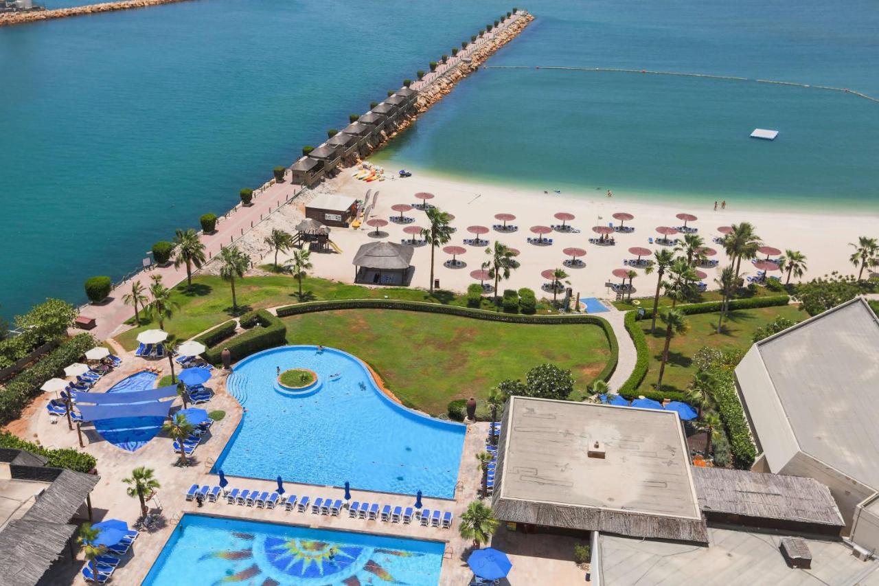 Radisson Blu Resort, Sharjah Exterior foto The beach at Jumeirah Beach Hotel